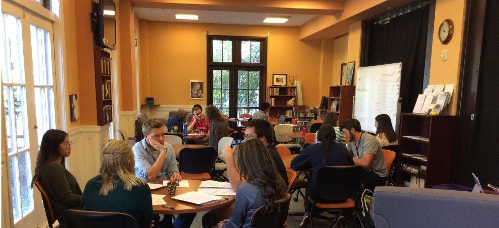 The Writing Center on a busy day, with Writing Circles and 1-1 sessions around the room.